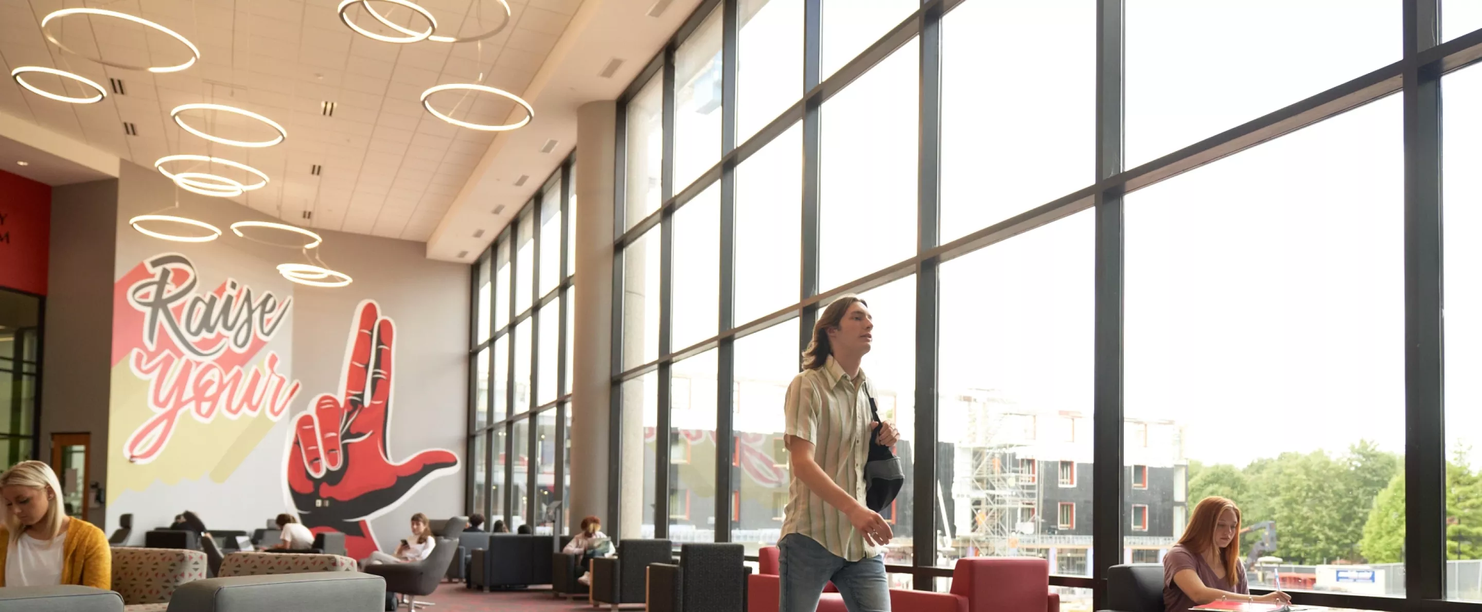 Student walking through the Student Activities Center.