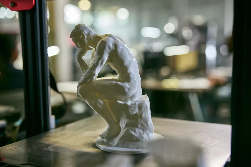 A miniature sculpture of the Thinker in the AMIST facility.